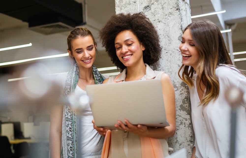 three ladies smiling