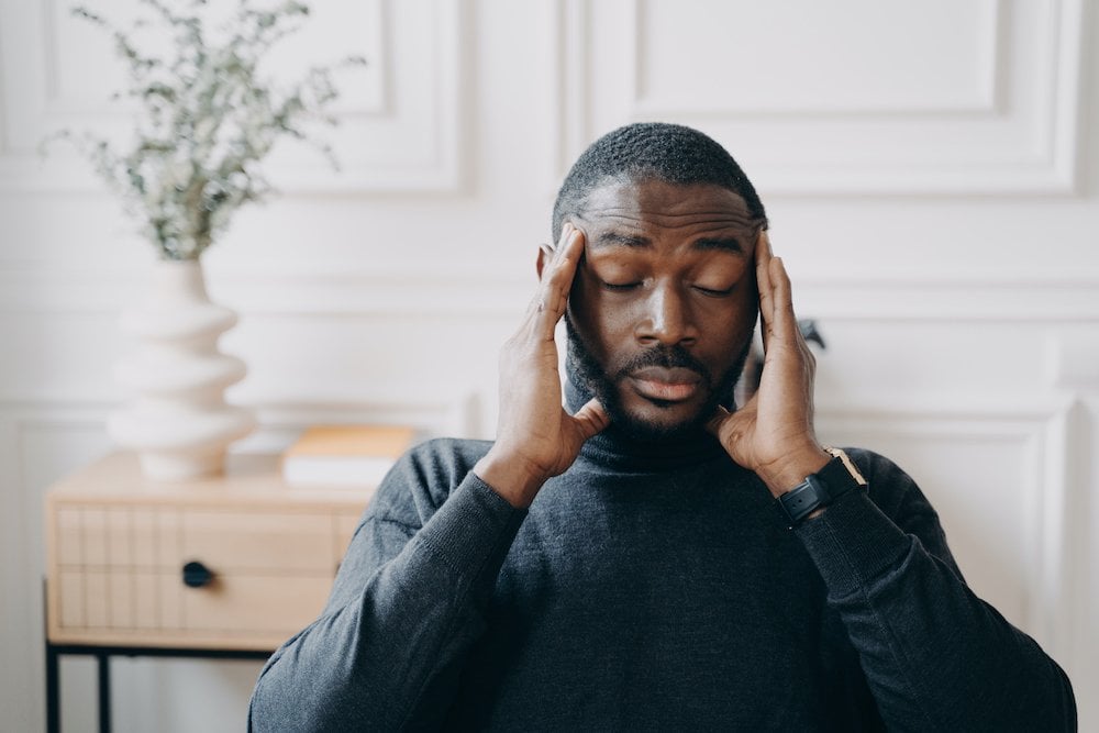 Man holding his head, stressed